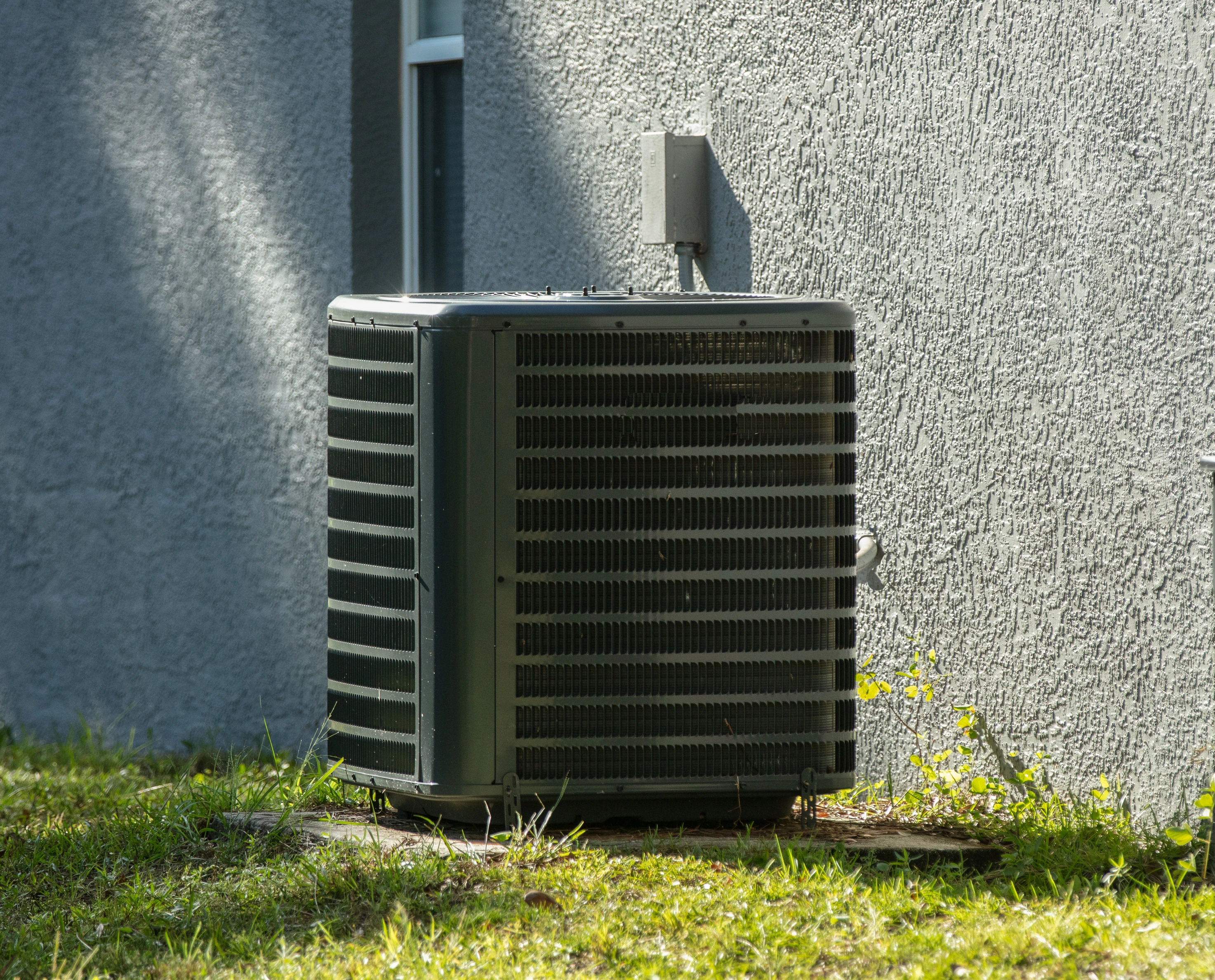 A clean and efficient outdoor air conditioning unit after a successful repair in Catoosa.