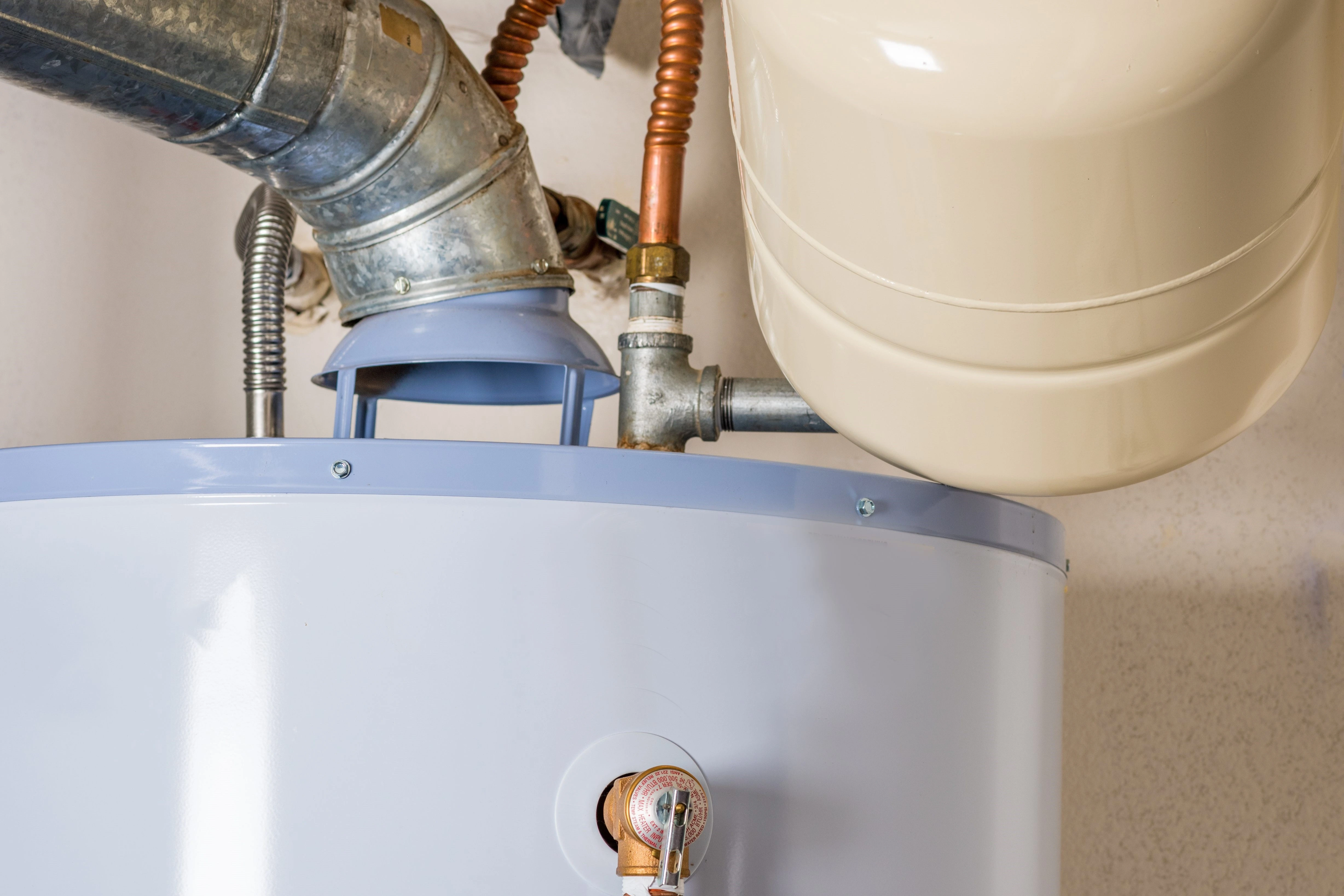 A traditional boiler system with copper piping, representing a common boiler installation in Tulsa.