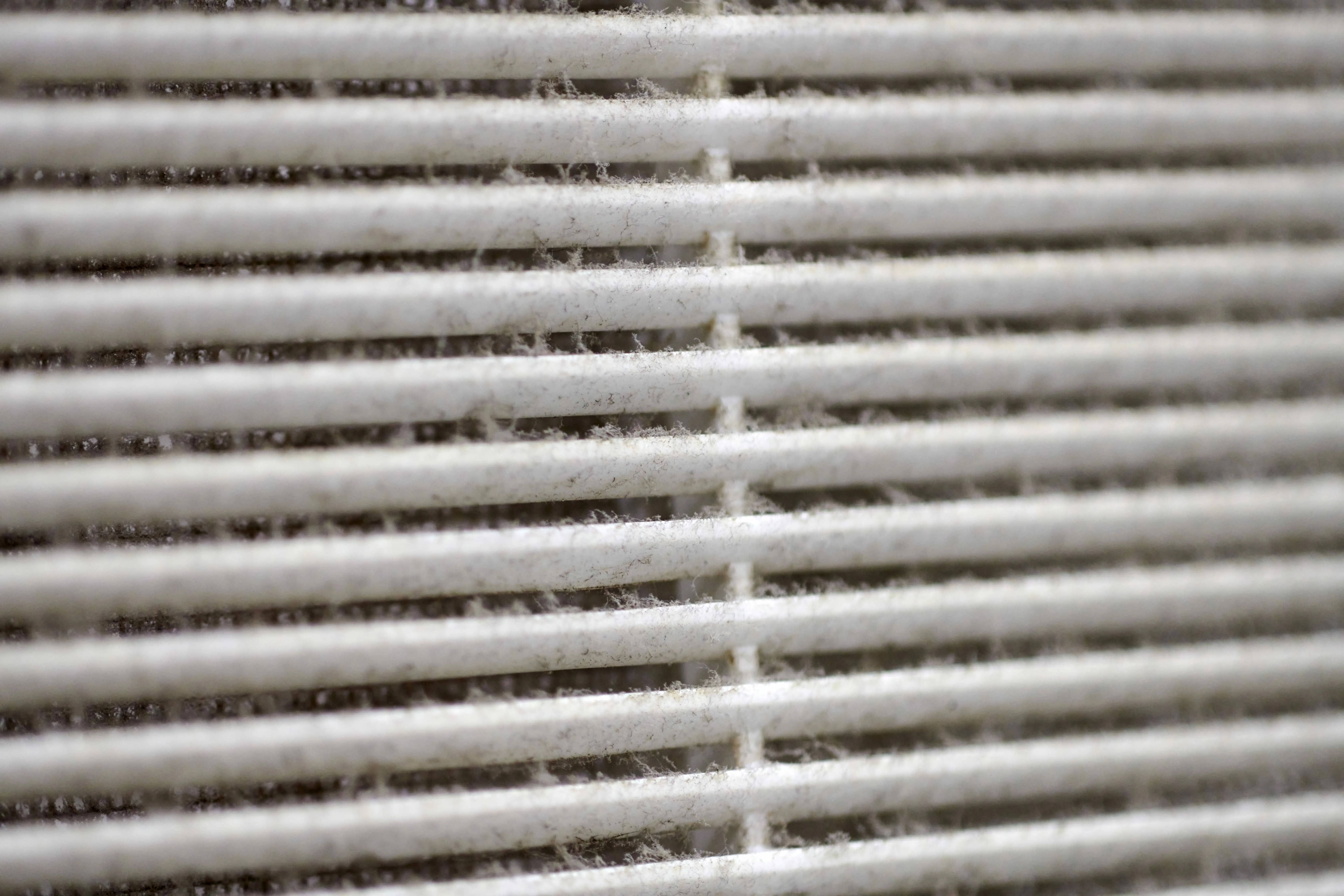 An outdoor HVAC condenser unit in Tulsa requiring professional AC repair from Air Dynamics.